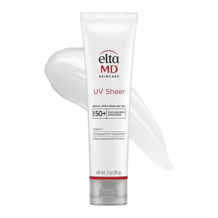 Hand dispensing a small pump of EltaMD UV Sheer onto fingertips, product tube visible, natural daylight